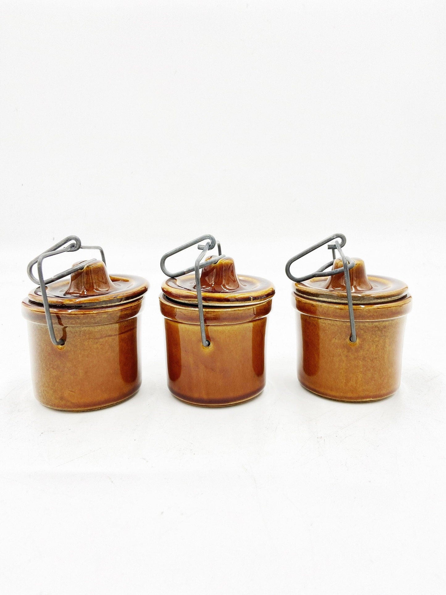 Brown Cheese Crocks, Set of 3 Canisters, Wire Closures, Farmhouse Country Pottery -Located at Funkyhouse Vintage Antique Store, Weiser Idaho