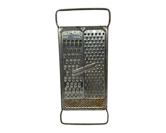 http://funkyhousevintage.com/cdn/shop/files/vintage-metal-cheese-grater-all-in-one-mid-century-grater-mid-century-kitchen-gadgets-shabby-chic-decor-located-at-funkyhouse-vintage-antique-store-weiser-idaho-1_644b912d-4a11-4b27-b121-054a92961877.jpg?v=1688593349