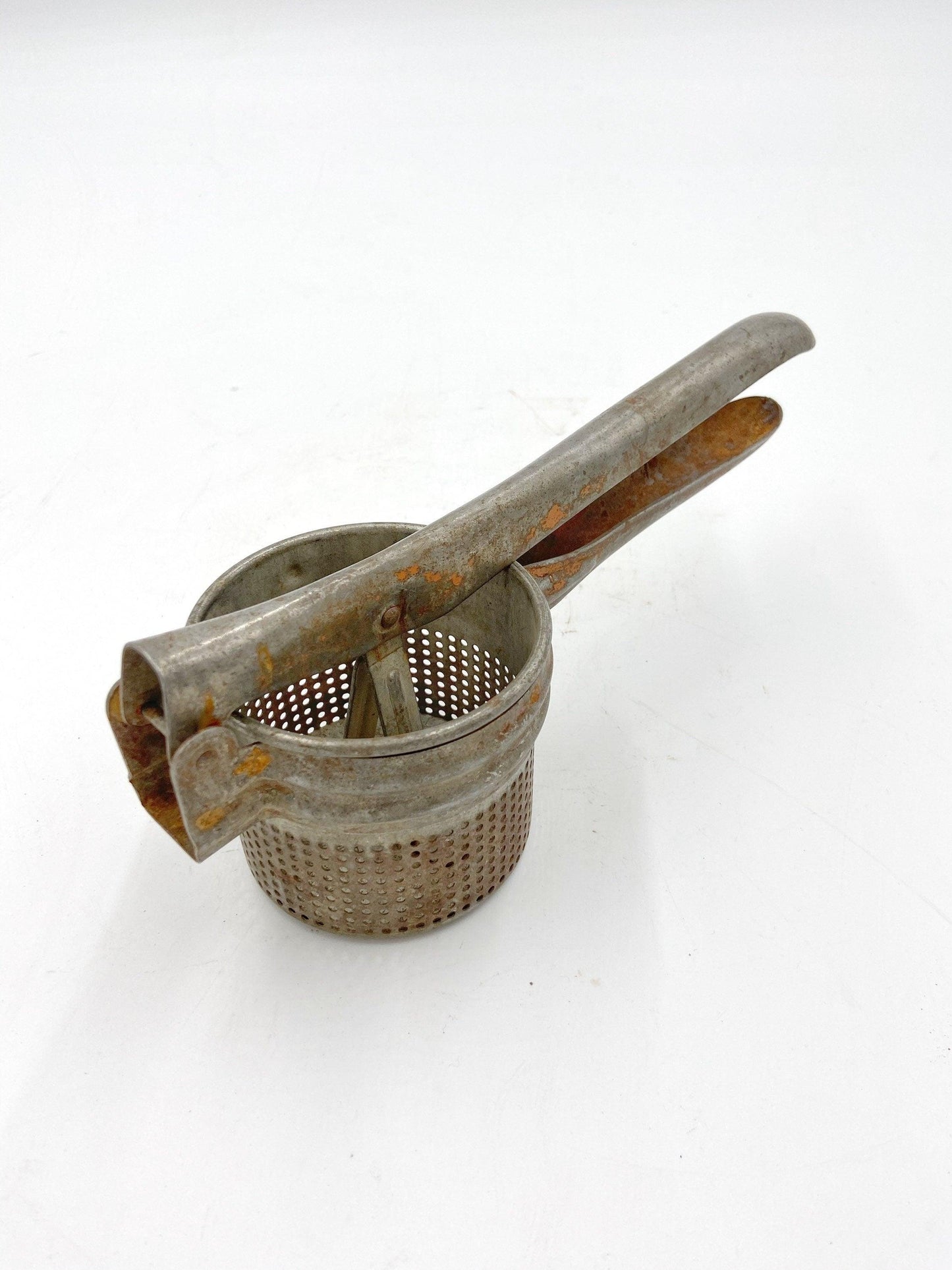 Vintage Rice Strainer, Metal Potato Masher or Fruit Juicer -Located at Funkyhouse Vintage Antique Store, Weiser Idaho