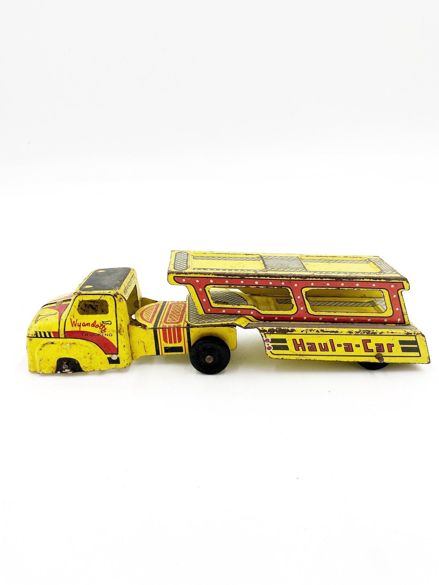 Vintage Tin Litho Wyandotte Trucking Car Hauler, Haul A Car, Tin Red Yellow Truck And Trailer Toy -Located at Funkyhouse Vintage Antique Store, Weiser Idaho
