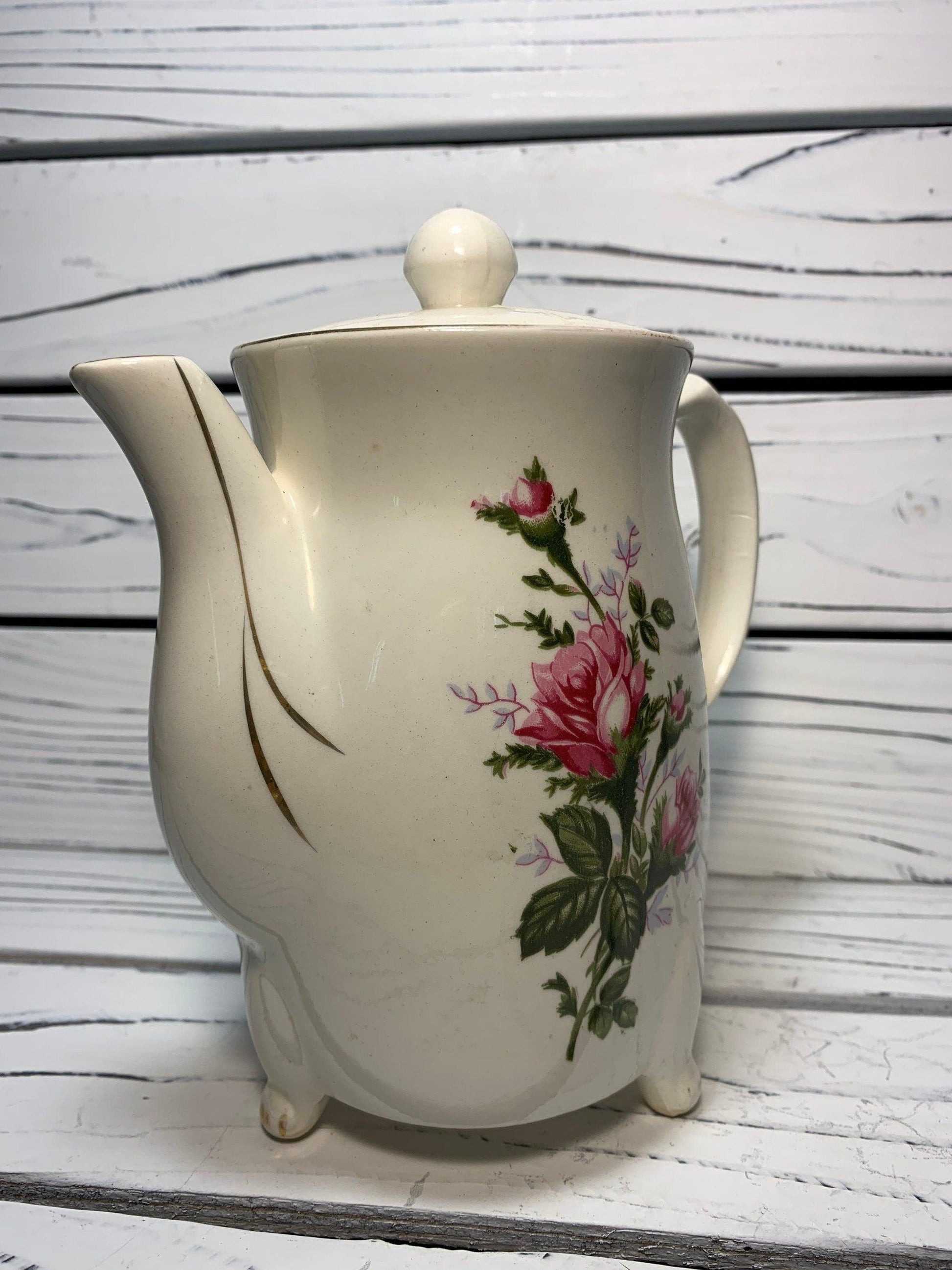 https://funkyhousevintage.com/cdn/shop/files/vintage-electric-tea-pot-kettle-ceramic-hot-water-heater-from-japan-with-flower-design-located-at-funkyhouse-vintage-antique-store-weiser-idaho-5.jpg?v=1688594257&width=1946
