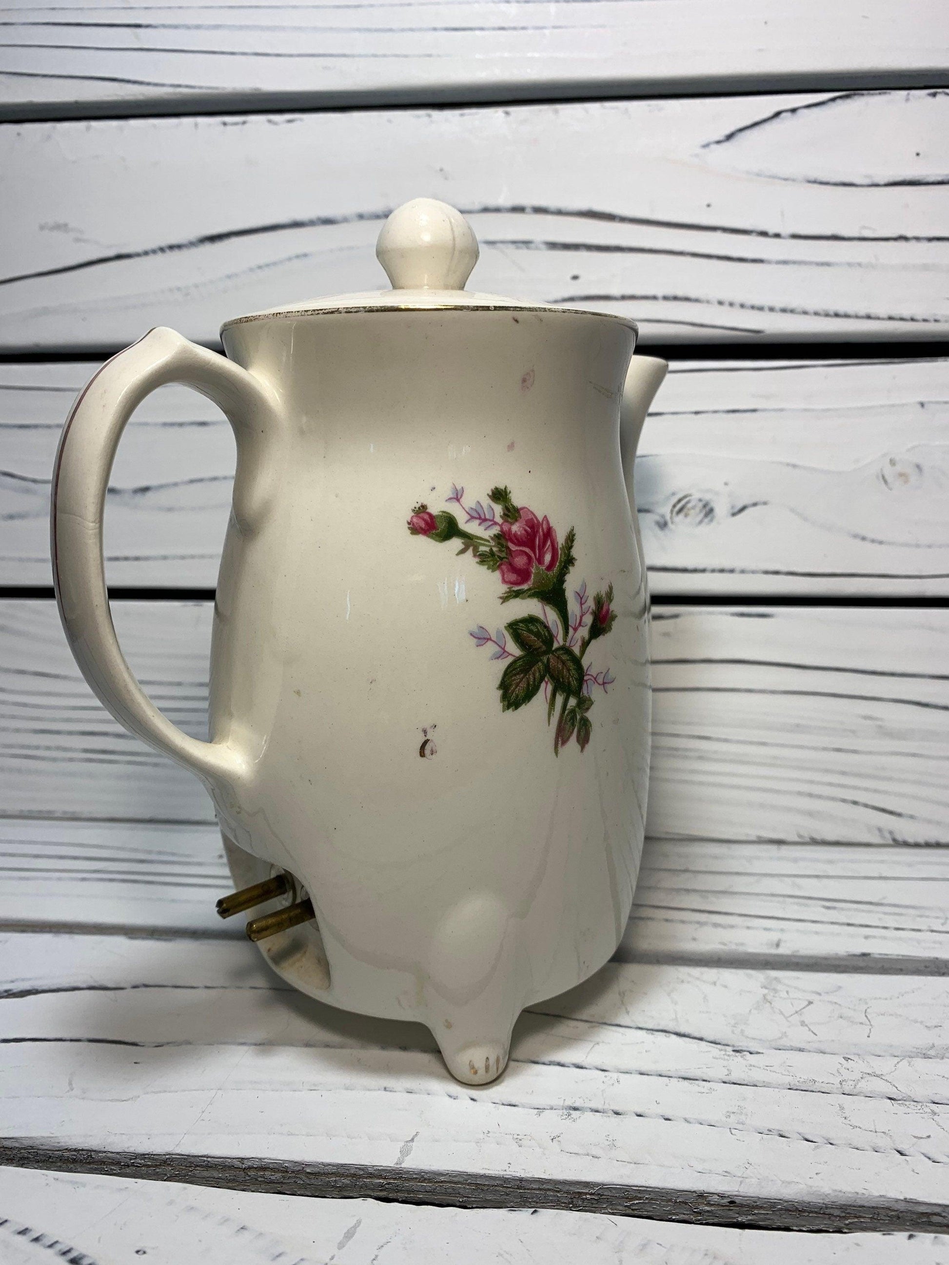 https://funkyhousevintage.com/cdn/shop/files/vintage-electric-tea-pot-kettle-ceramic-hot-water-heater-from-japan-with-flower-design-located-at-funkyhouse-vintage-antique-store-weiser-idaho-9.jpg?v=1688594274&width=1946