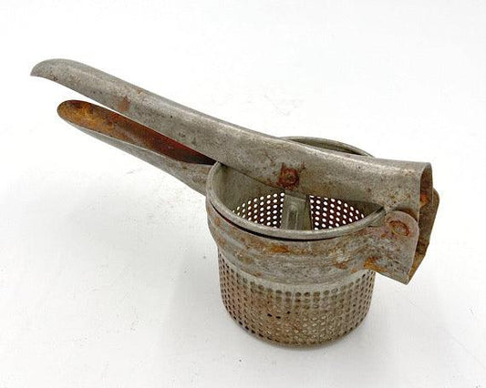 Vintage Rice Strainer, Metal Potato Masher or Fruit Juicer -Located at Funkyhouse Vintage Antique Store, Weiser Idaho