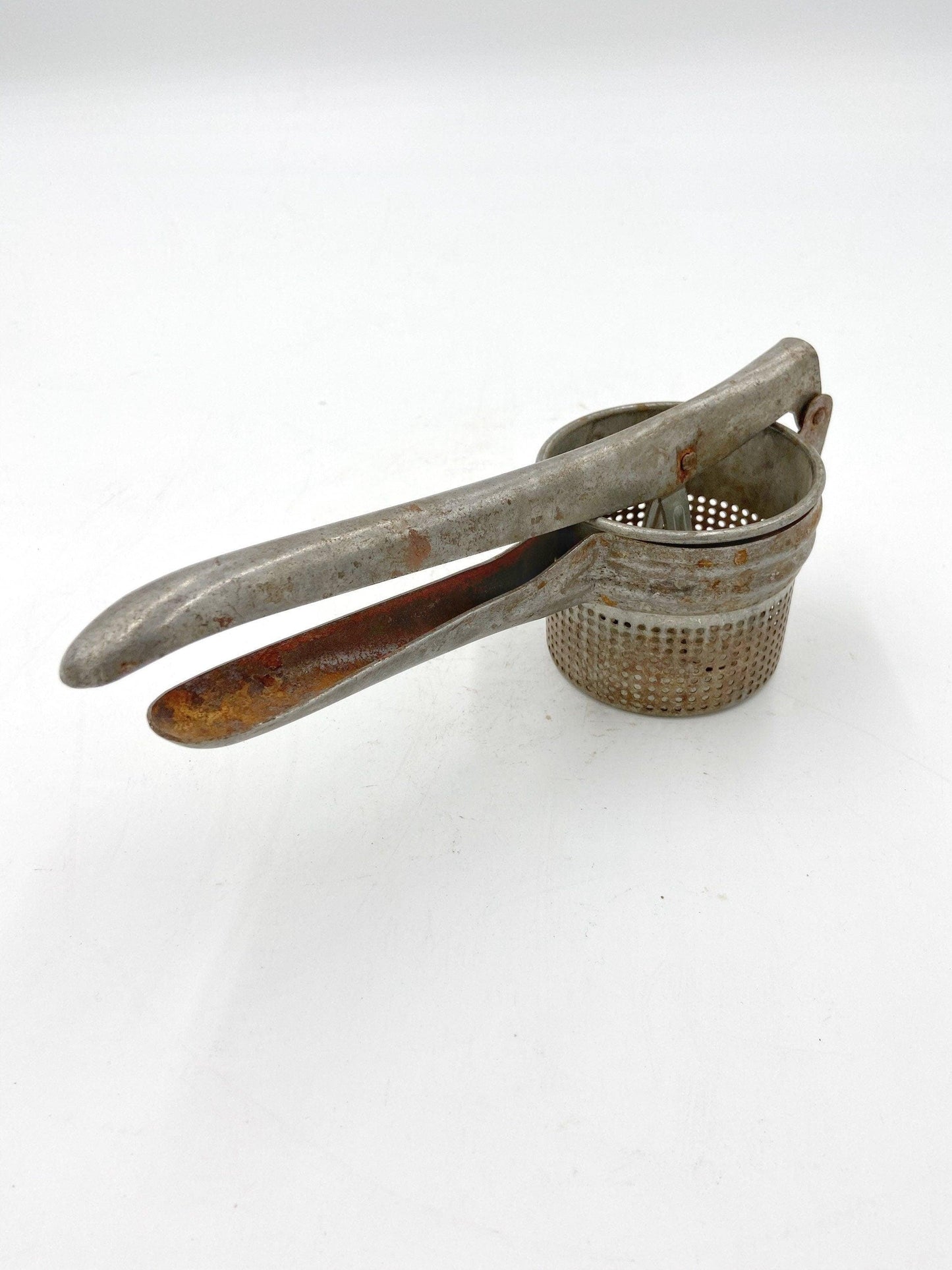 Vintage Rice Strainer, Metal Potato Masher or Fruit Juicer -Located at Funkyhouse Vintage Antique Store, Weiser Idaho