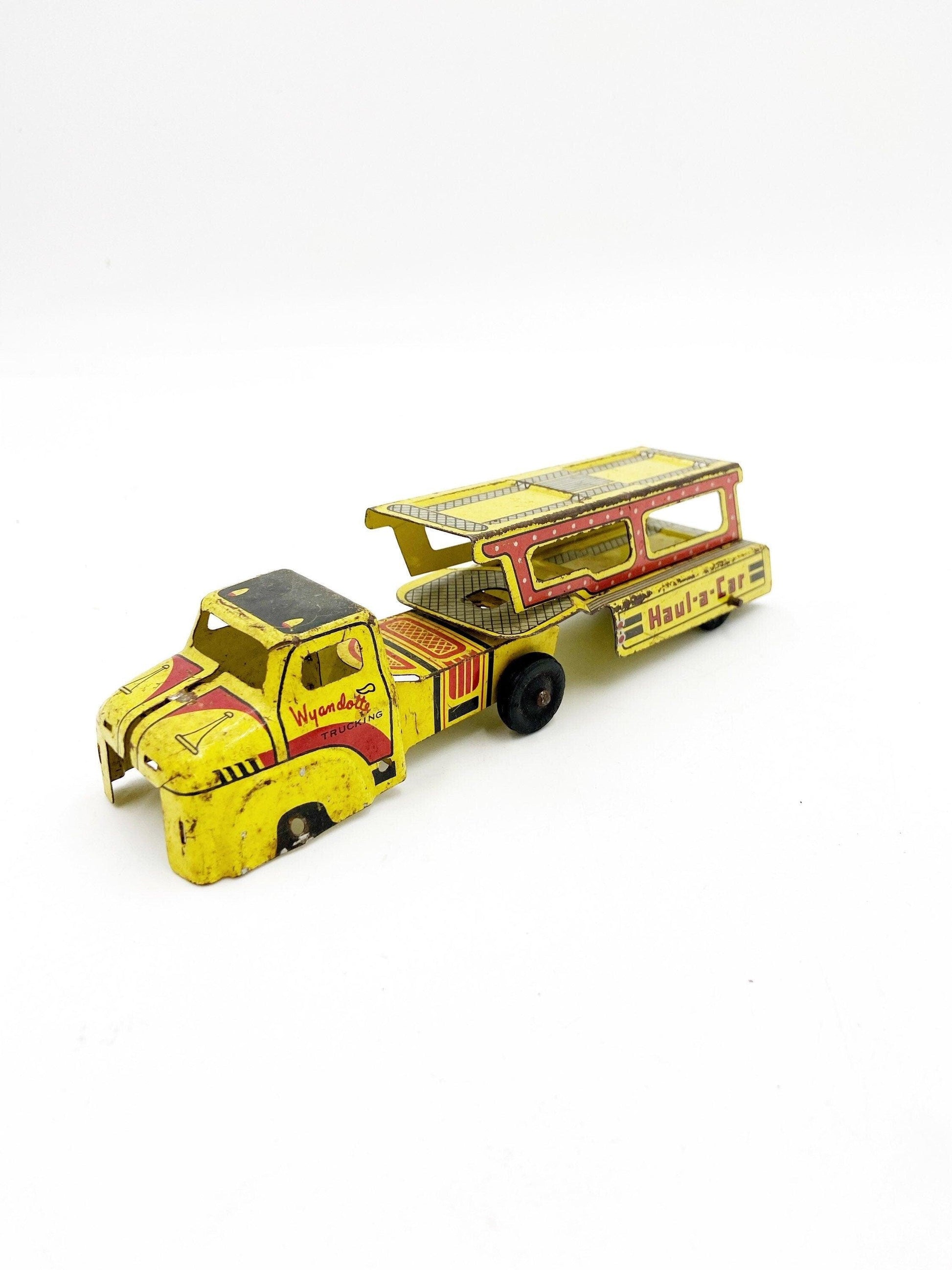 Vintage Tin Litho Wyandotte Trucking Car Hauler, Haul A Car, Tin Red Yellow Truck And Trailer Toy -Located at Funkyhouse Vintage Antique Store, Weiser Idaho