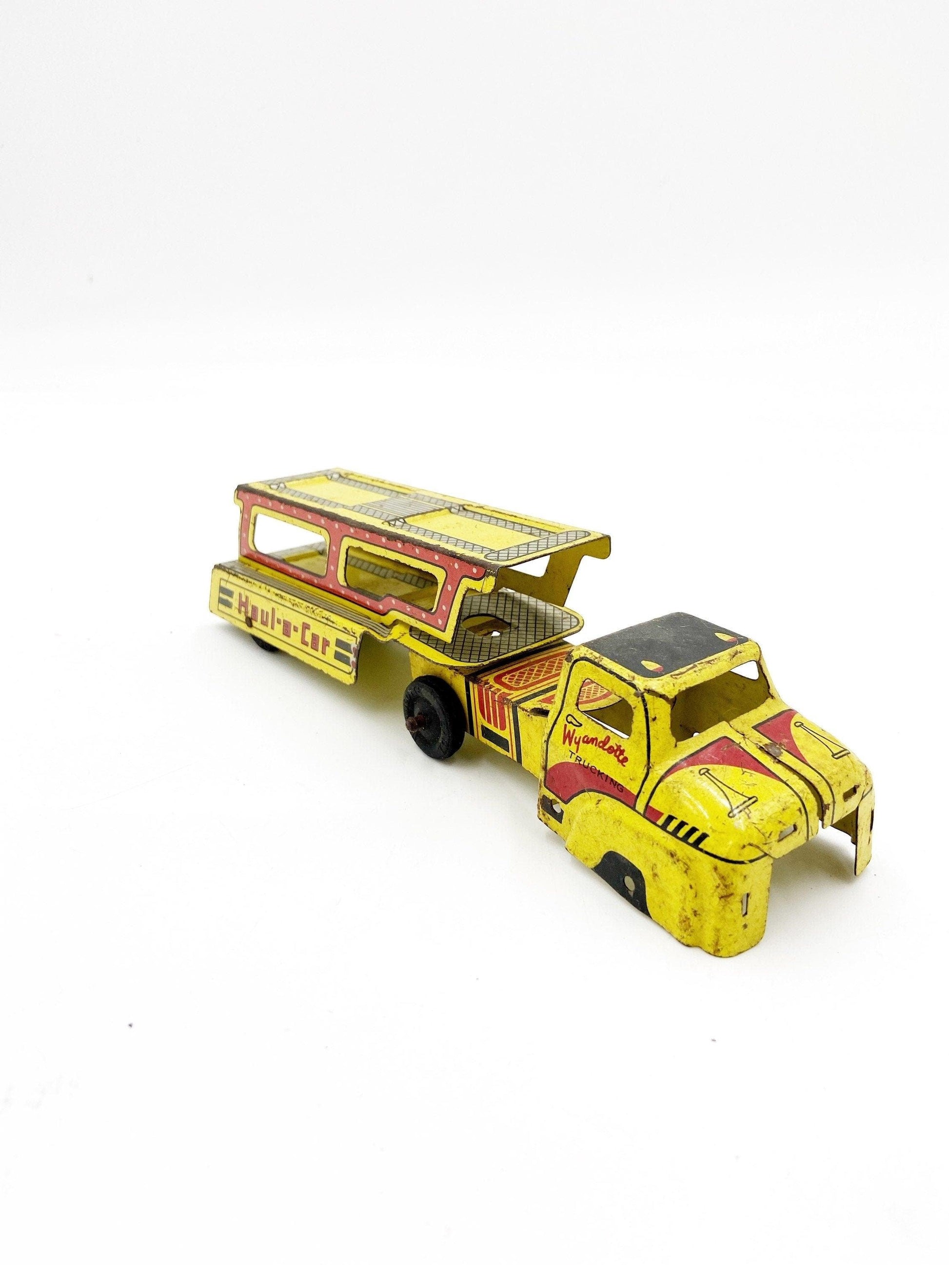Vintage Tin Litho Wyandotte Trucking Car Hauler, Haul A Car, Tin Red Yellow Truck And Trailer Toy -Located at Funkyhouse Vintage Antique Store, Weiser Idaho
