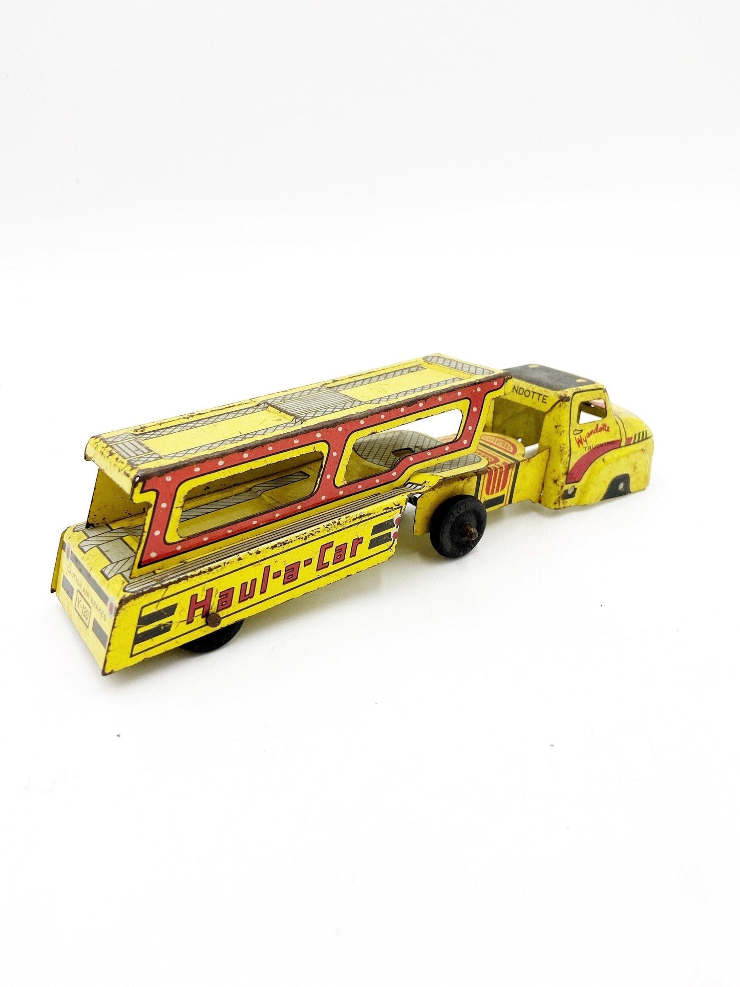 Vintage Tin Litho Wyandotte Trucking Car Hauler, Haul A Car, Tin Red Yellow Truck And Trailer Toy -Located at Funkyhouse Vintage Antique Store, Weiser Idaho