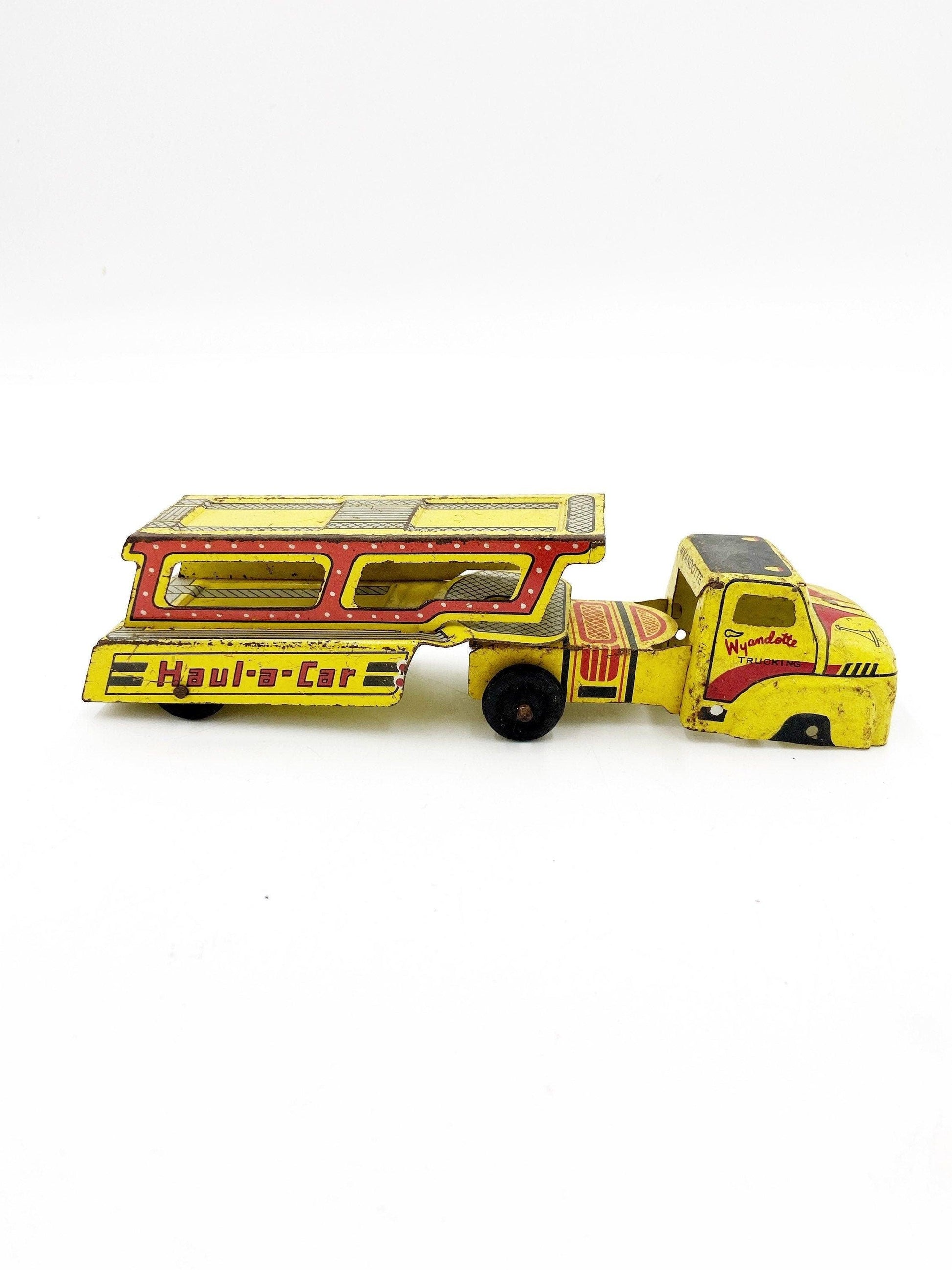 Vintage Tin Litho Wyandotte Trucking Car Hauler, Haul A Car, Tin Red Yellow Truck And Trailer Toy -Located at Funkyhouse Vintage Antique Store, Weiser Idaho
